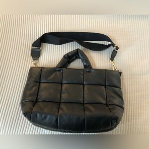 New bag never used. Sadly I took the tags off but it’s in perfect condition!